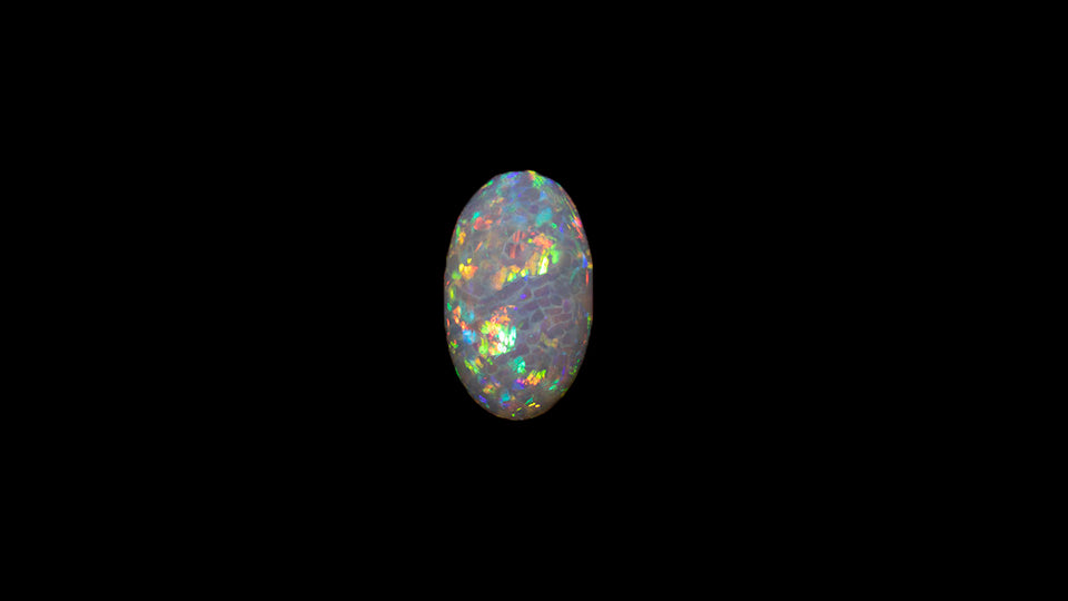 8.5 carat rare and unusual wavey honeycomb pattern Welo Ethiopia oval shaped cabochon.