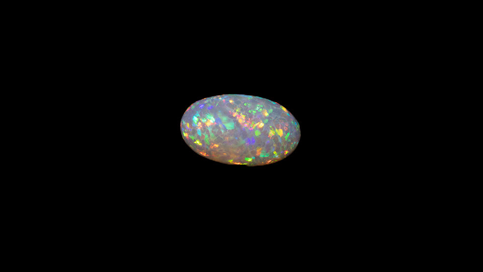 8.5 carat rare and unusual wavey honeycomb pattern Welo Ethiopia oval shaped cabochon.
